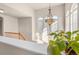 Upstairs hallway featuring hardwood floors and large windows at 9965 E 143Rd Way, Brighton, CO 80602