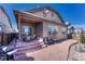 Inviting backyard with stamped concrete patio, covered area and ample seating space at 12732 Fisher Dr, Englewood, CO 80112