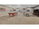 Finished basement featuring a pool table, neutral carpeting and decor for an inviting entertaining space at 12732 Fisher Dr, Englewood, CO 80112