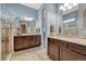 Bathroom featuring double vanity, granite countertops, and a glass enclosed shower at 12732 Fisher Dr, Englewood, CO 80112
