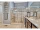 Modern bathroom with tiled shower, granite counters, and contemporary fixtures at 12732 Fisher Dr, Englewood, CO 80112
