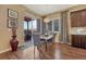 Cozy dining area with hardwood floors, backyard access, and modern light fixture at 12732 Fisher Dr, Englewood, CO 80112
