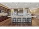 Kitchen with granite countertops, an island with seating, and stainless steel appliances at 12732 Fisher Dr, Englewood, CO 80112