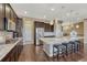 Kitchen with stainless steel appliances and granite countertops, with island seating at 12732 Fisher Dr, Englewood, CO 80112