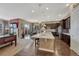 Open-concept kitchen with granite island, seamlessly connecting to the living and dining areas at 12732 Fisher Dr, Englewood, CO 80112