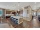 Spacious kitchen with dark cabinets, a large island, and stainless steel appliances at 12732 Fisher Dr, Englewood, CO 80112