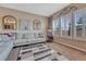 Comfortable living room with large windows, shutters, and stylish decor at 12732 Fisher Dr, Englewood, CO 80112