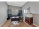 Home office with gray walls, dark trim, a built-in bookcase and neutral carpet at 12732 Fisher Dr, Englewood, CO 80112