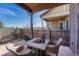 Inviting covered patio with stylish outdoor furniture and a fire pit, perfect for entertaining or relaxing outdoors at 12732 Fisher Dr, Englewood, CO 80112