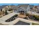 Charming home featuring a well-manicured lawn, complemented by landscaped garden beds and a spacious driveway at 5519 Genoa St, Denver, CO 80249