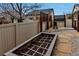 Outdoor space featuring a raised garden bed, decorative privacy screens, rock features, and stone pavers at 5519 Genoa St, Denver, CO 80249
