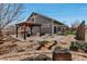 Well-manicured backyard featuring a gazebo, rock garden, and patio, perfect for outdoor entertaining at 5519 Genoa St, Denver, CO 80249
