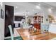 Open-concept dining area flowing into the kitchen with ample space and natural light at 5519 Genoa St, Denver, CO 80249