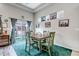 Cozy dining area with an outdoor patio view and carpet at 5519 Genoa St, Denver, CO 80249