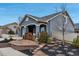 Charming single-Gathering home featuring a stucco exterior, and well-maintained front yard with decorative landscaping at 5519 Genoa St, Denver, CO 80249