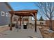 A relaxing outdoor gazebo with a fire pit and comfortable seating area at 5519 Genoa St, Denver, CO 80249
