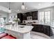 Modern kitchen and connecting dining area provides ample space for cooking and dining at 5519 Genoa St, Denver, CO 80249