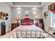 Comfortable bedroom with recessed lights, bedside tables, and small windows for ample natural light at 5519 Genoa St, Denver, CO 80249