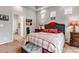 This bedroom boasts recessed lights, bedside tables, and a door leading to a walk-in closet at 5519 Genoa St, Denver, CO 80249