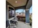 Cozy covered patio featuring a seating area, providing a relaxing outdoor space with neighborhood views at 5519 Genoa St, Denver, CO 80249