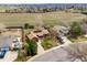 Aerial view of the property showcasing its landscaping, neighborhood, and proximity to nearby fields at 11875 W 107Th Ave, Broomfield, CO 80021