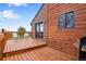 Beautiful wood deck with chairs and a grill, providing a relaxing outdoor space for enjoying the views and weather at 11875 W 107Th Ave, Broomfield, CO 80021