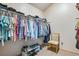 Walk-in closet with hanging racks and built-in shelving for shoes and accessories at 11875 W 107Th Ave, Broomfield, CO 80021