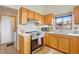 Traditional-style kitchen with tile backsplash and stainless steel appliances at 11875 W 107Th Ave, Broomfield, CO 80021