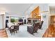 Spacious living room featuring a brick fireplace and vaulted ceilings at 11875 W 107Th Ave, Broomfield, CO 80021