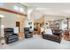 Spacious living room with vaulted ceilings, hardwood floors, and plenty of natural light, creating a warm and inviting ambiance at 11875 W 107Th Ave, Broomfield, CO 80021