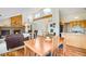 Open-concept dining and living area with ample natural light, ideal for entertaining and Gathering gatherings at 11875 W 107Th Ave, Broomfield, CO 80021
