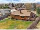 Backyard with mature landscaping and a cozy deck, perfect for outdoor entertaining and enjoying the serene surroundings at 11875 W 107Th Ave, Broomfield, CO 80021