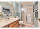 Bathroom features a glass-enclosed shower, ample vanity space, and modern fixtures at 6432 E Jamison Cir, Centennial, CO 80112