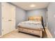 Cozy bedroom features a wooden bed frame with built-in storage and a blue patterned quilt at 6432 E Jamison Cir, Centennial, CO 80112