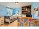 Comfortable blue bedroom with blue curtains and a bookshelf filled with stuffed animals at 6432 E Jamison Cir, Centennial, CO 80112