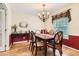 Elegant dining room featuring a chandelier and a large dining table with six chairs at 6432 E Jamison Cir, Centennial, CO 80112