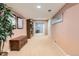 Finished basement hallway with carpet flooring and a bookshelf, leading to living spaces at 6432 E Jamison Cir, Centennial, CO 80112