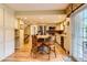 Open concept kitchen with an island, stainless appliances, and hardwood floors at 6432 E Jamison Cir, Centennial, CO 80112