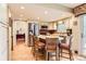Bright and airy kitchen features an island and stainless steel appliances at 6432 E Jamison Cir, Centennial, CO 80112