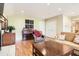 Comfortable living room featuring hardwood floors, fireplace, and built-in cabinets at 6432 E Jamison Cir, Centennial, CO 80112