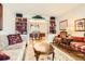 Inviting living room with shelving and an open view to the dining room at 6432 E Jamison Cir, Centennial, CO 80112