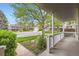 Inviting porch view showcases the tranquil neighborhood and mature trees at 6432 E Jamison Cir, Centennial, CO 80112