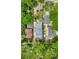 An aerial view of a neighborhood showing multiple homes with mature trees and manicured lawns at 821 Collyer St, Longmont, CO 80501