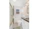 Charming bathroom featuring a unique vessel sink, black and white tile floor, and a glass-enclosed shower at 821 Collyer St, Longmont, CO 80501