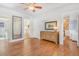 Open dining area with hardwood floors, decorative mirror, and neutral walls at 821 Collyer St, Longmont, CO 80501