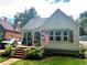 Charming home with fresh exterior paint, brick steps, and a quaint front porch at 821 Collyer St, Longmont, CO 80501