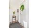 Bright foyer featuring white walls, wood floors, and a welcoming wreath on the door at 821 Collyer St, Longmont, CO 80501