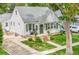 Charming home exterior with a well-maintained lawn, mature trees, and a quaint front porch perfect for relaxing at 821 Collyer St, Longmont, CO 80501