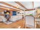 Open-concept living and dining area with brick fireplace feature at 821 Collyer St, Longmont, CO 80501