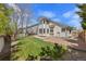 Well-maintained backyard with green grass and neutral home at 8985 Edgewood Ln, Highlands Ranch, CO 80130